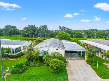 Beautiful Tampa home with lush landscaping and spacious driveway for sale.