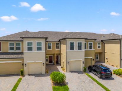 Modern townhouses with attached garages in Tampa, Florida, showcasing vibrant neighborhoods and contemporary housing options.