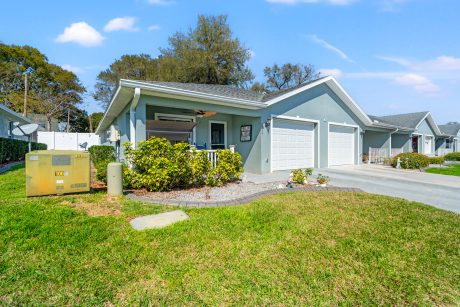 Modern Tampa home with fresh exterior paint and landscaped yard, perfect for sale or rent.