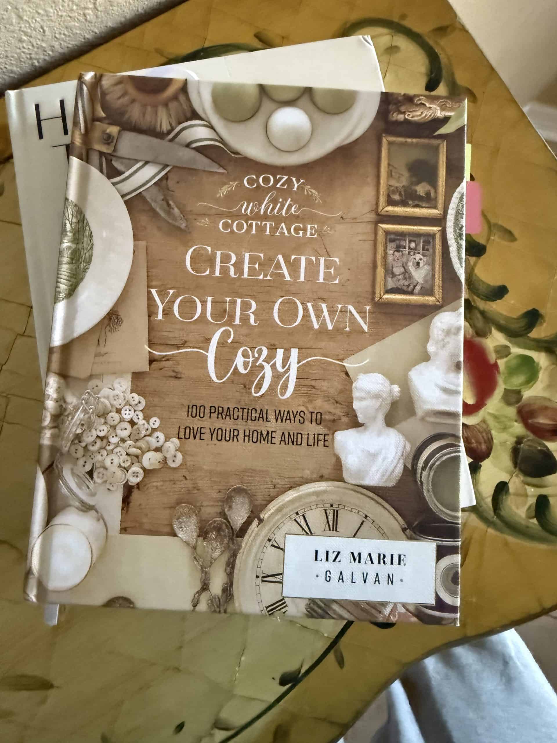 Cozy white cottage decor book on creating a warm home and life.