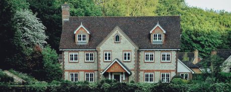 Picturesque historic house nestled among lush green trees in Tampa.
